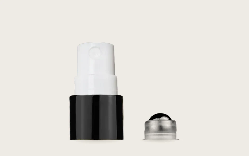 A black fine-mist spray top and a metal roller-ball top